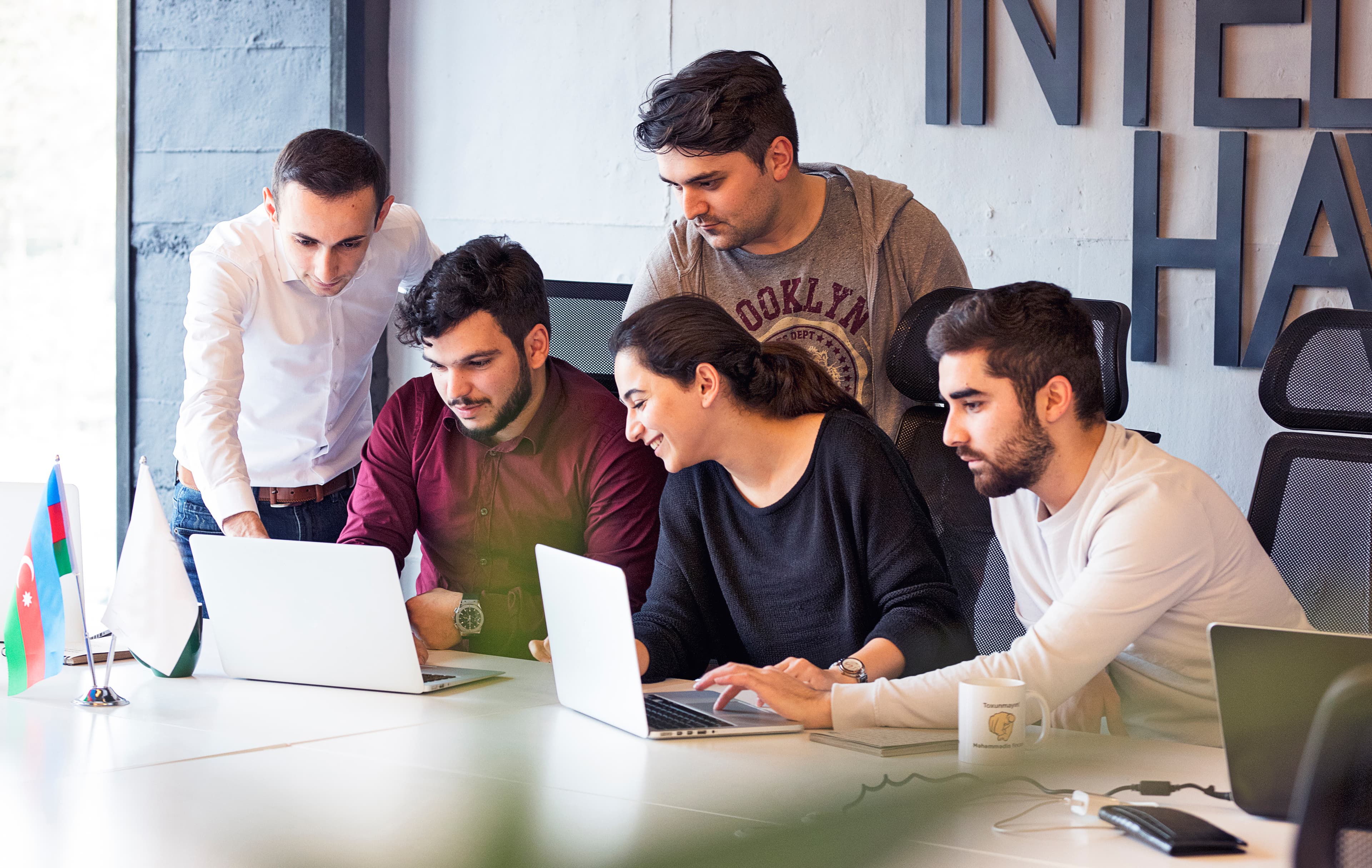 [ABOUT — Design team collaboration scene]